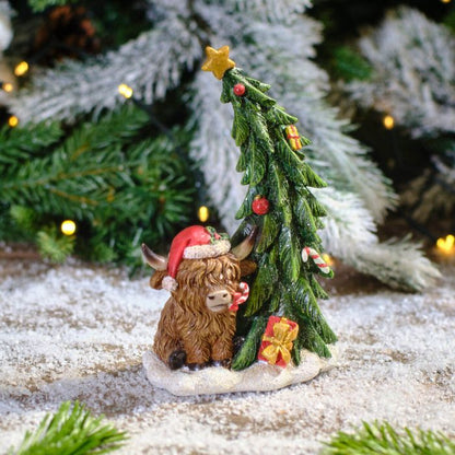 CHRISTMAS RESIN HIGHLAND COW WITH TREE ORNAMENT